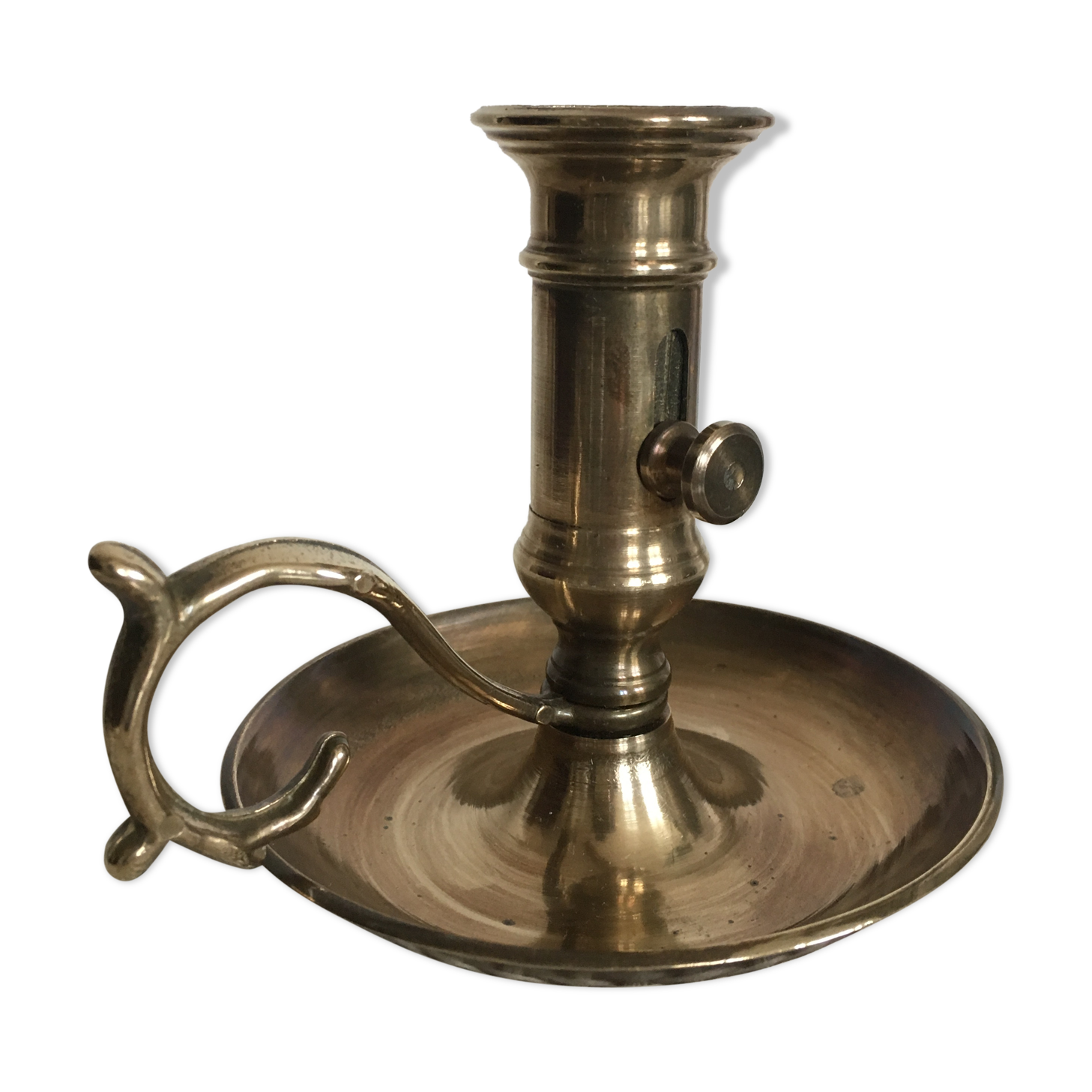 Old brass candlestick called "rat tail"