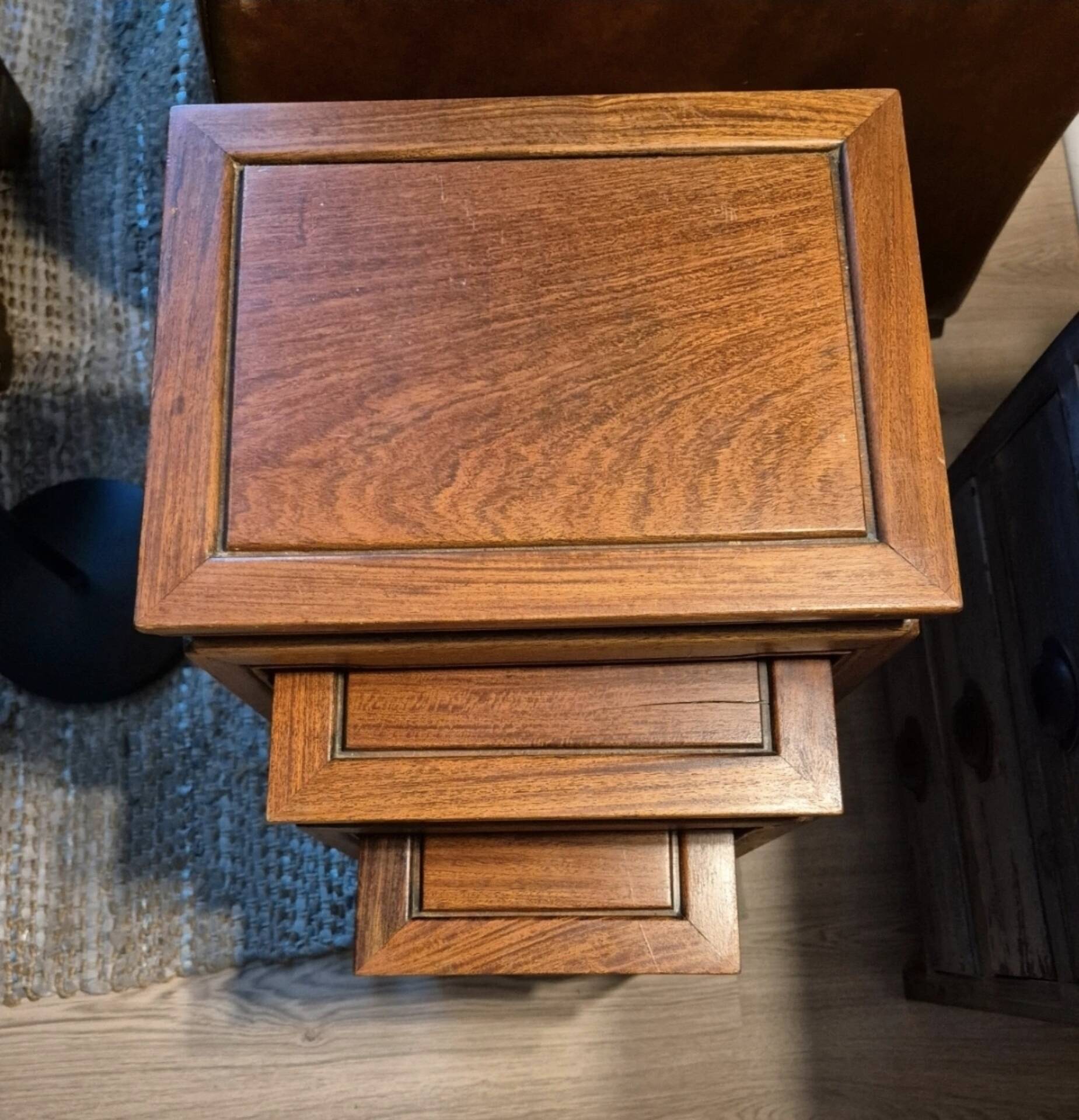 Stackable 3-piece nesting table in Asian teak wood with chinoiserie design.