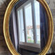 Oval mirror in gilded wood 67X52