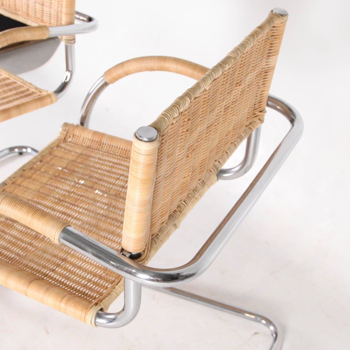 Pair of wicker and metal armchairs