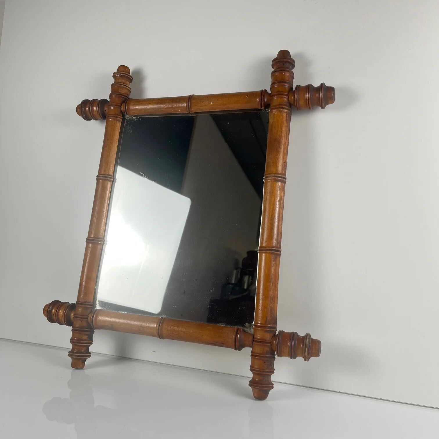 Wooden turned mirror in bamboo style, circa 1900-1930.