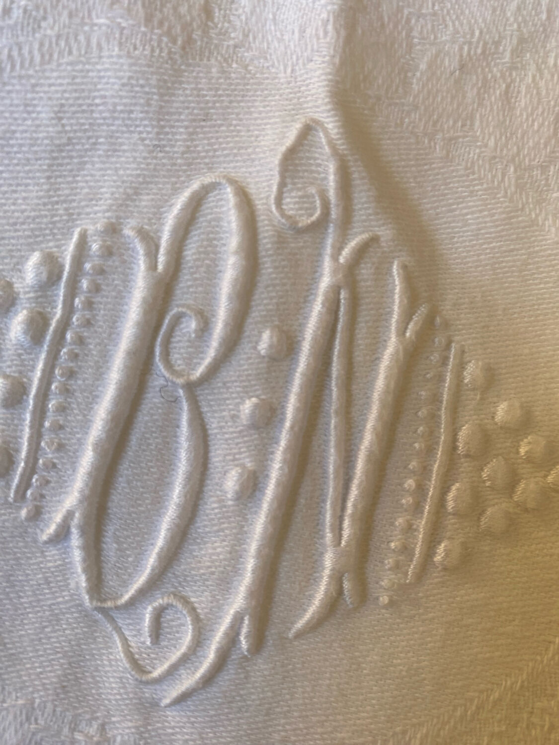 White cotton and linen tablecloth with central monogram from the 1960s.