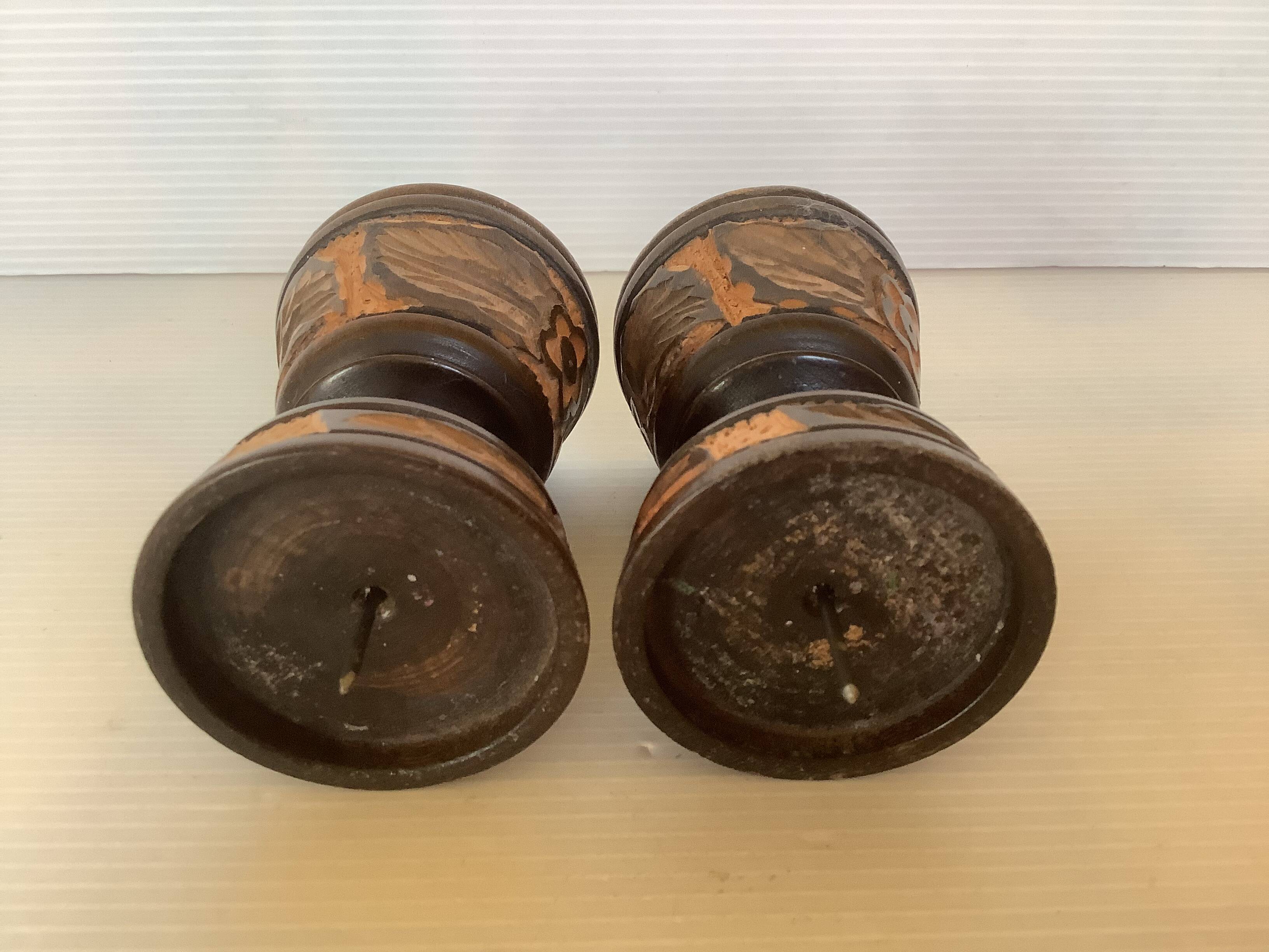 Pair of carved wooden candlesticks