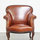 Fauteuil ancien en peau de mouton entièrement restauré