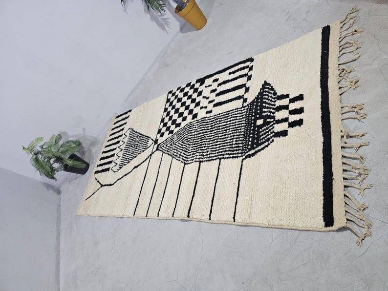 Handmade pure wool rug in black and white, size 150 x 250 cm.