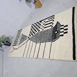 Handmade pure wool rug in black and white, size 150 x 250 cm.