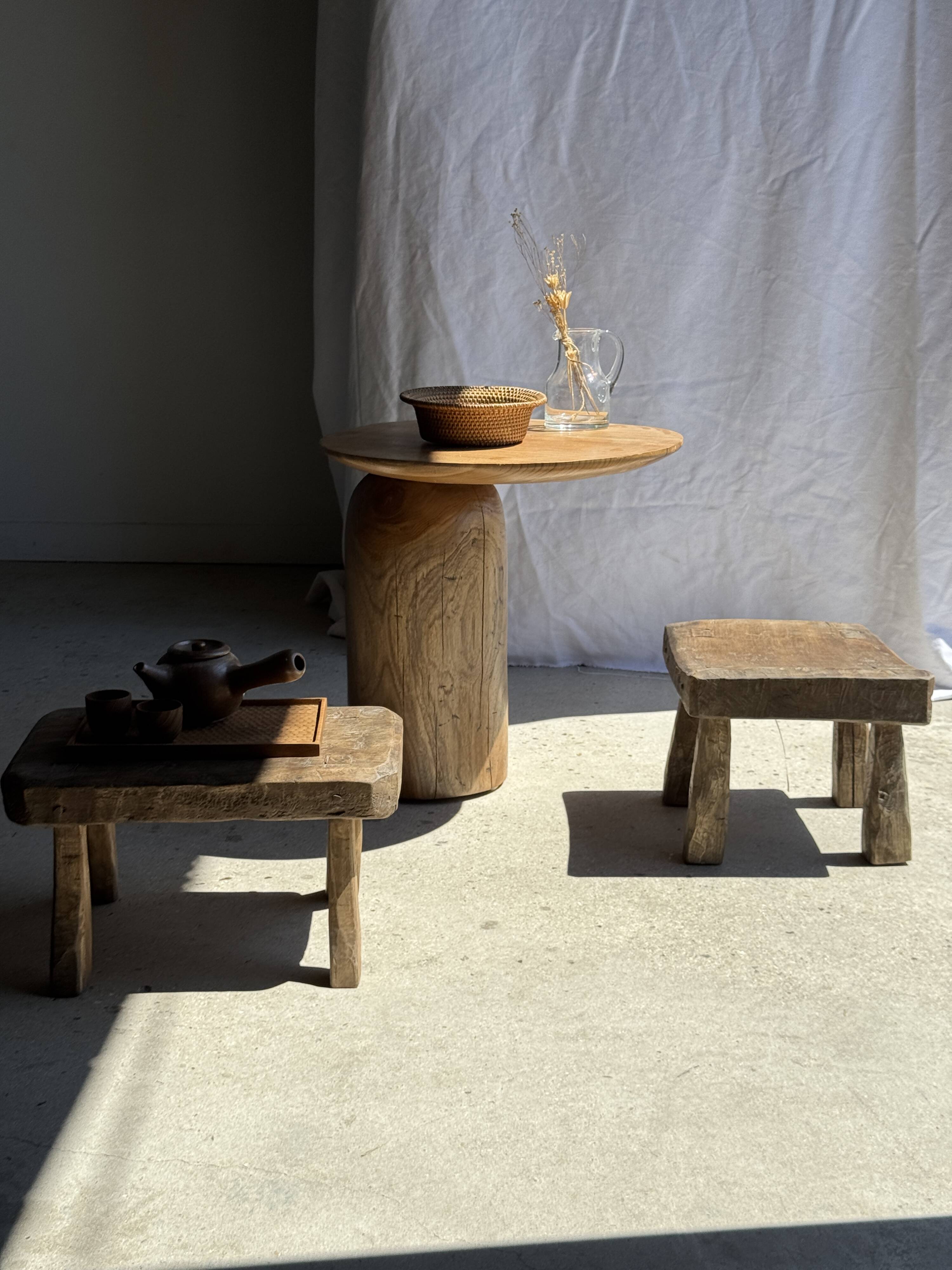Small stool, square solid teak side table with a curved seat.