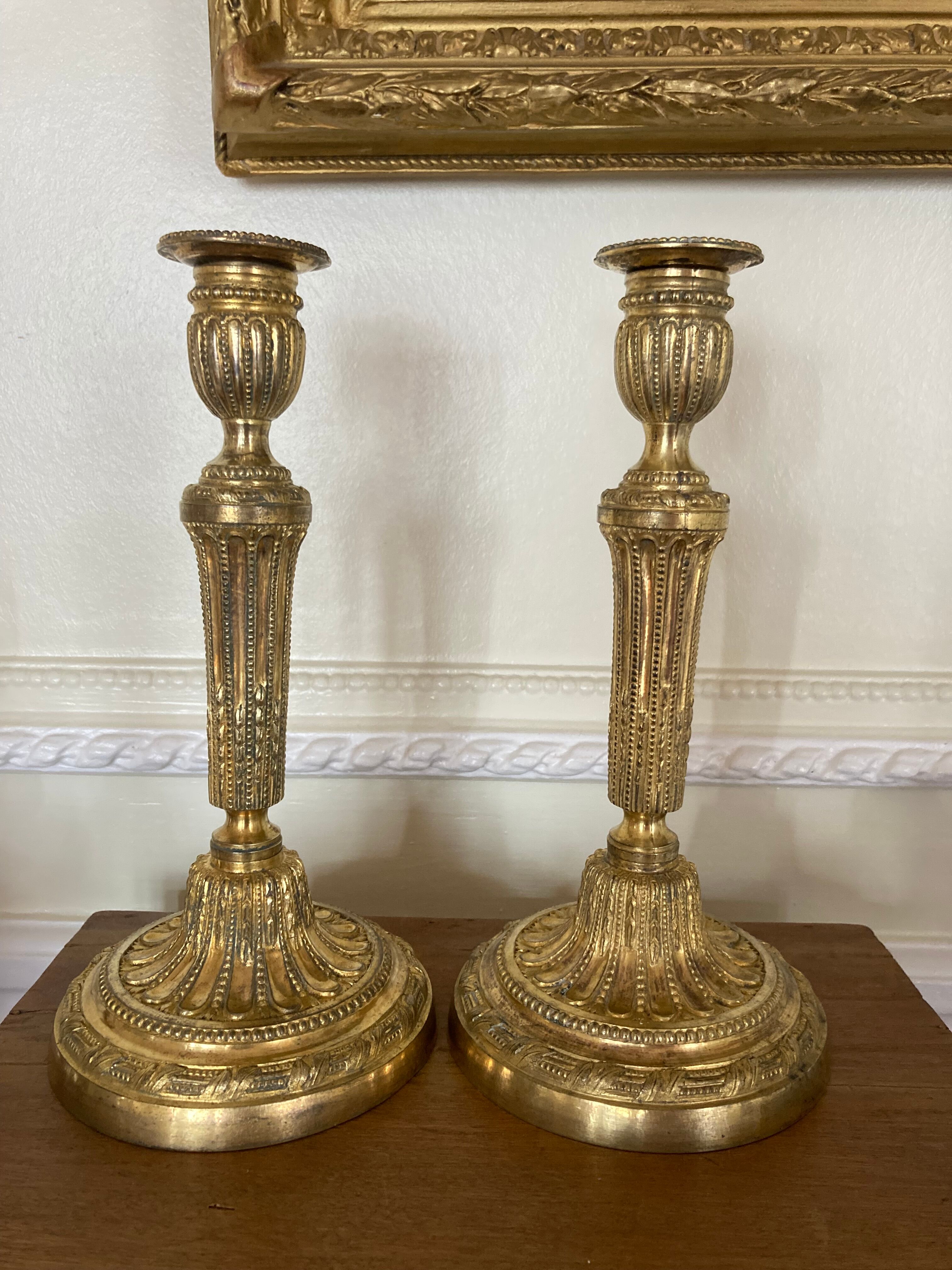 Pair of Louis XVI torch candlesticks in gilded bronze