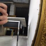 Golden oval mirror