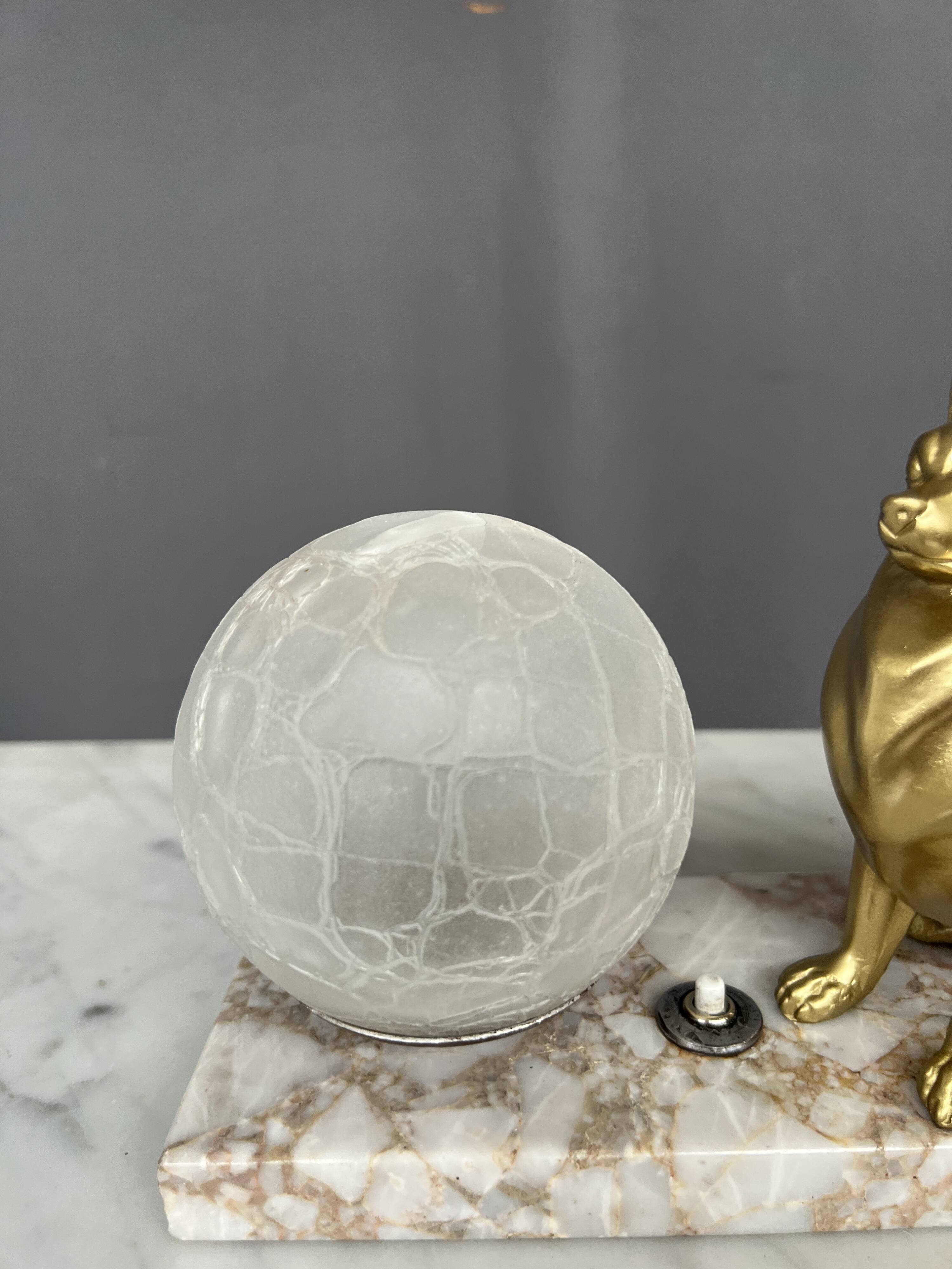 Night lamp with a Spitz figurine in Art Deco style on a marble base.