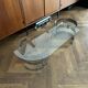 Table basse ovale design années 70 en verre et pieds chromé « S »