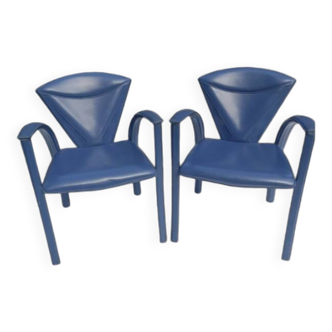 Armchairs covered in vintage blue leather