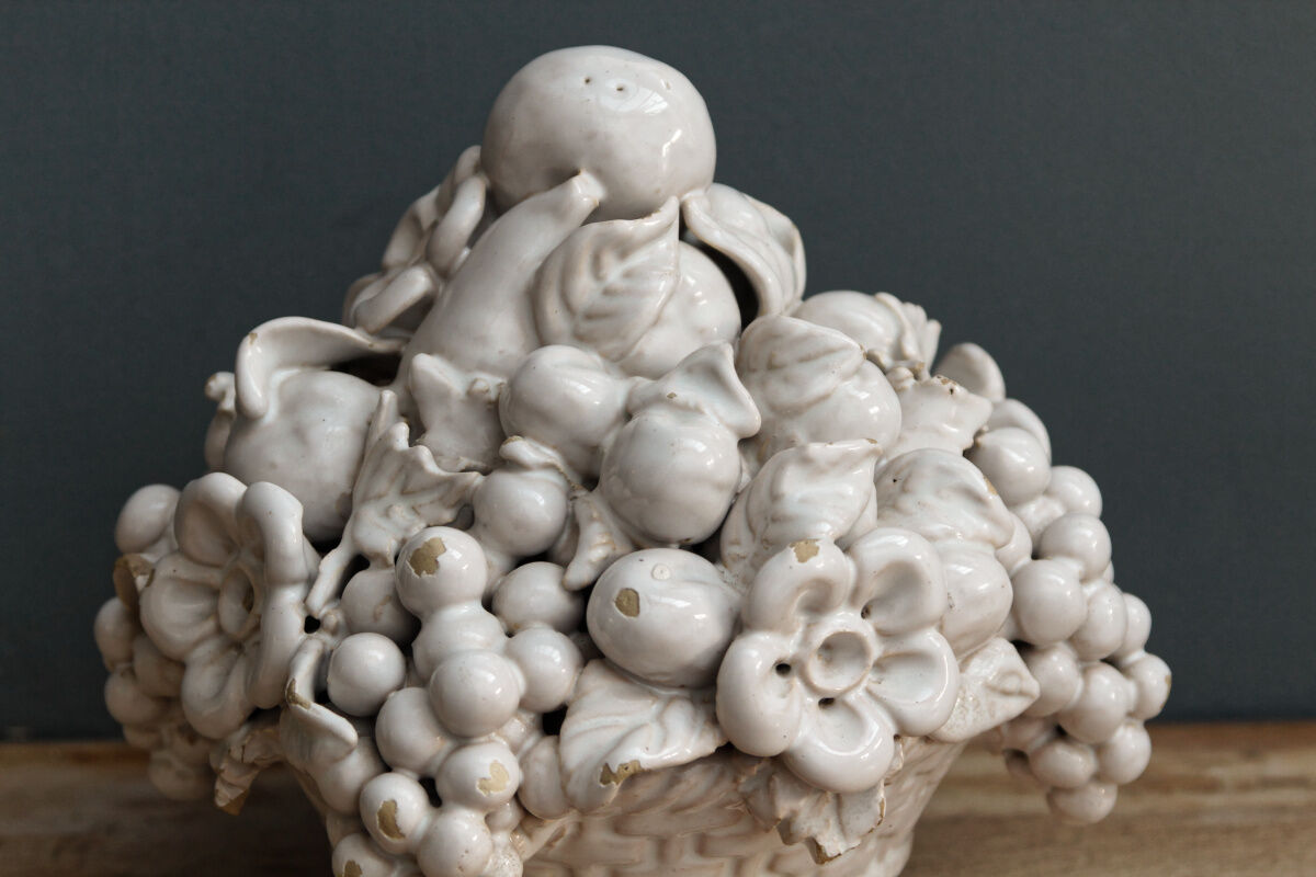 Ornamental basket decorated with trompe l'oeil fruits
