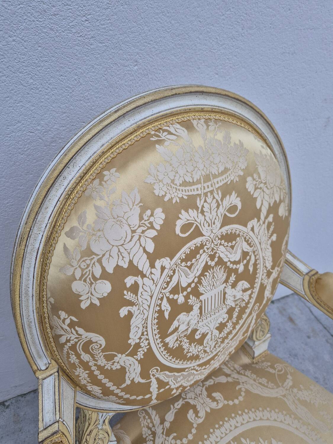 Louis XVI style cabriolet armchair with decorated medallion