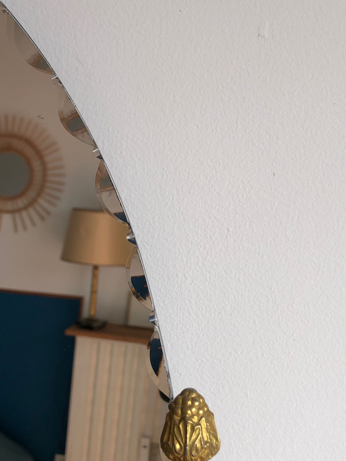 Beveled wall mirror with gold frame