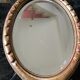 Hand-facing beveled mirror surrounded by wood dimension: height -38cm- width -15.5cm-