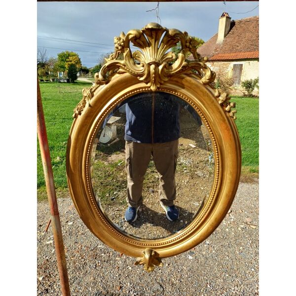 Miroir ovale en bois et stuc doré 19ème