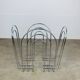 Postmodern chrome metal magazine rack from the 1980s.