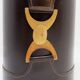 Brown leather wastepaper basket with decorative gold metal buckle.