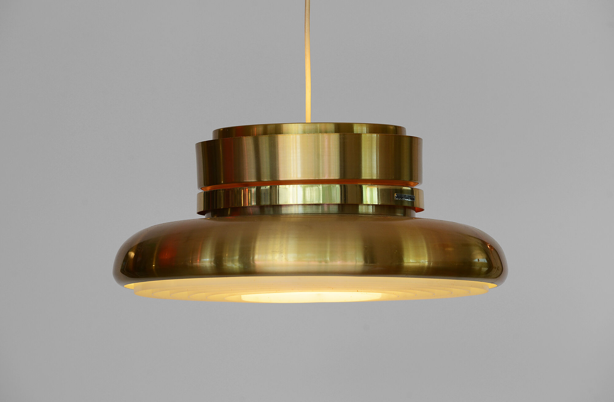 Gold coloured aluminium hanging light by Carl-Thore for Granhaga.