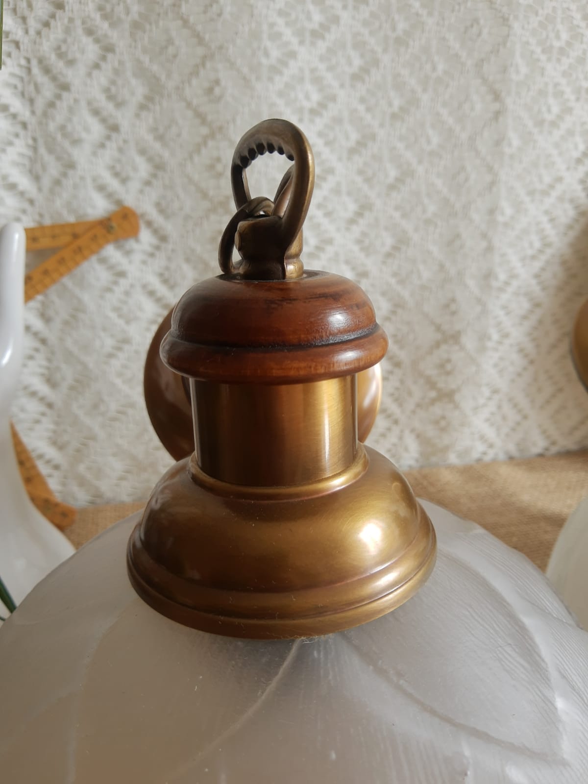 Pair of frosted glass flower pendant lights with vintage wood and brass