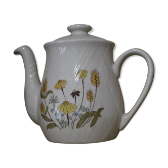 Teapot with yellow flowers