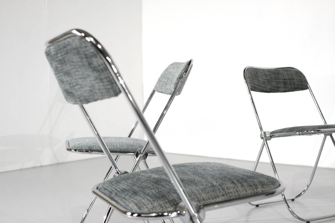 Set of 9 chrome folding chairs with fabric from the 1970s.