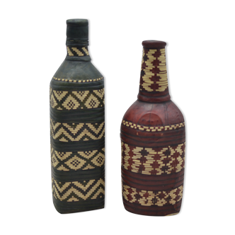 Set of 2 decorative vintage bottles covered with leather & wicker