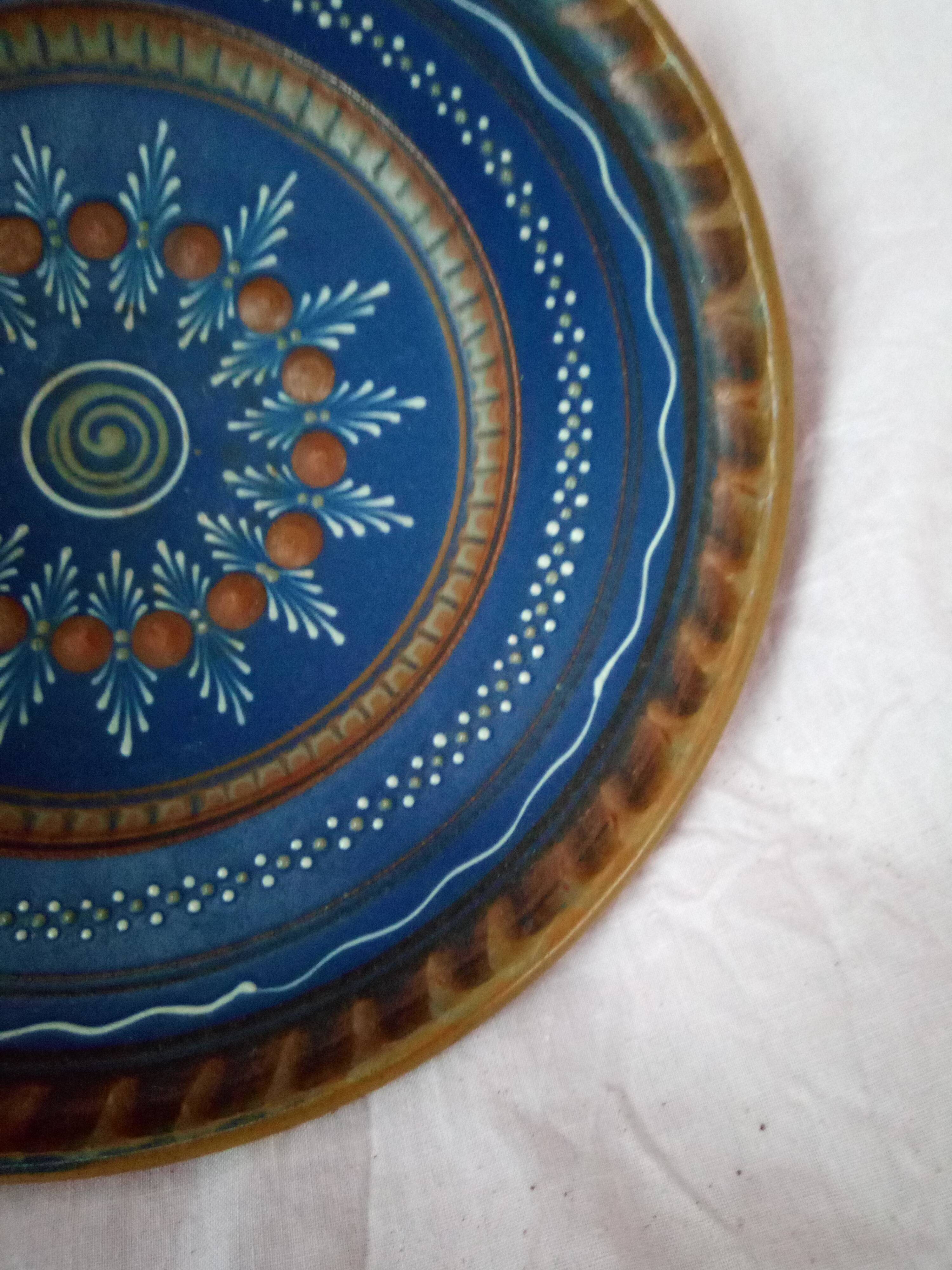 Plate in painted sandstone