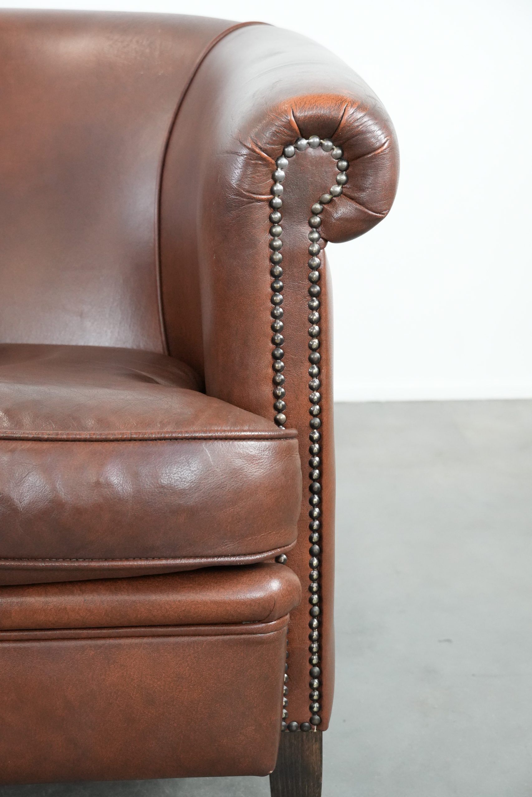 Cognac-coloured cow leather club armchair in English style