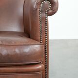 Cognac-coloured cow leather club armchair in English style