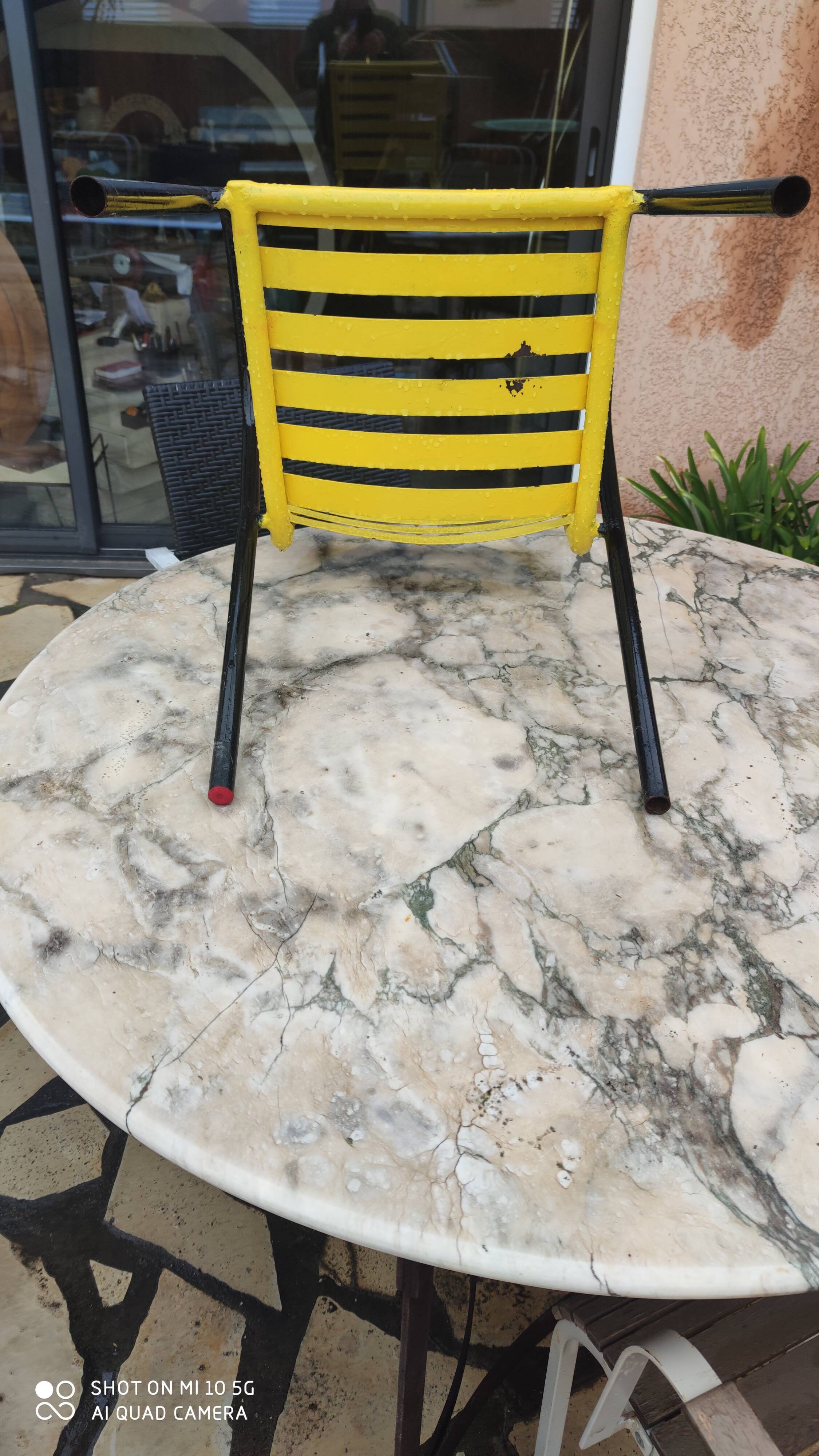 Armchair in black and yellow painted steel, circa 1950, in the style of Mallet-Stevens
