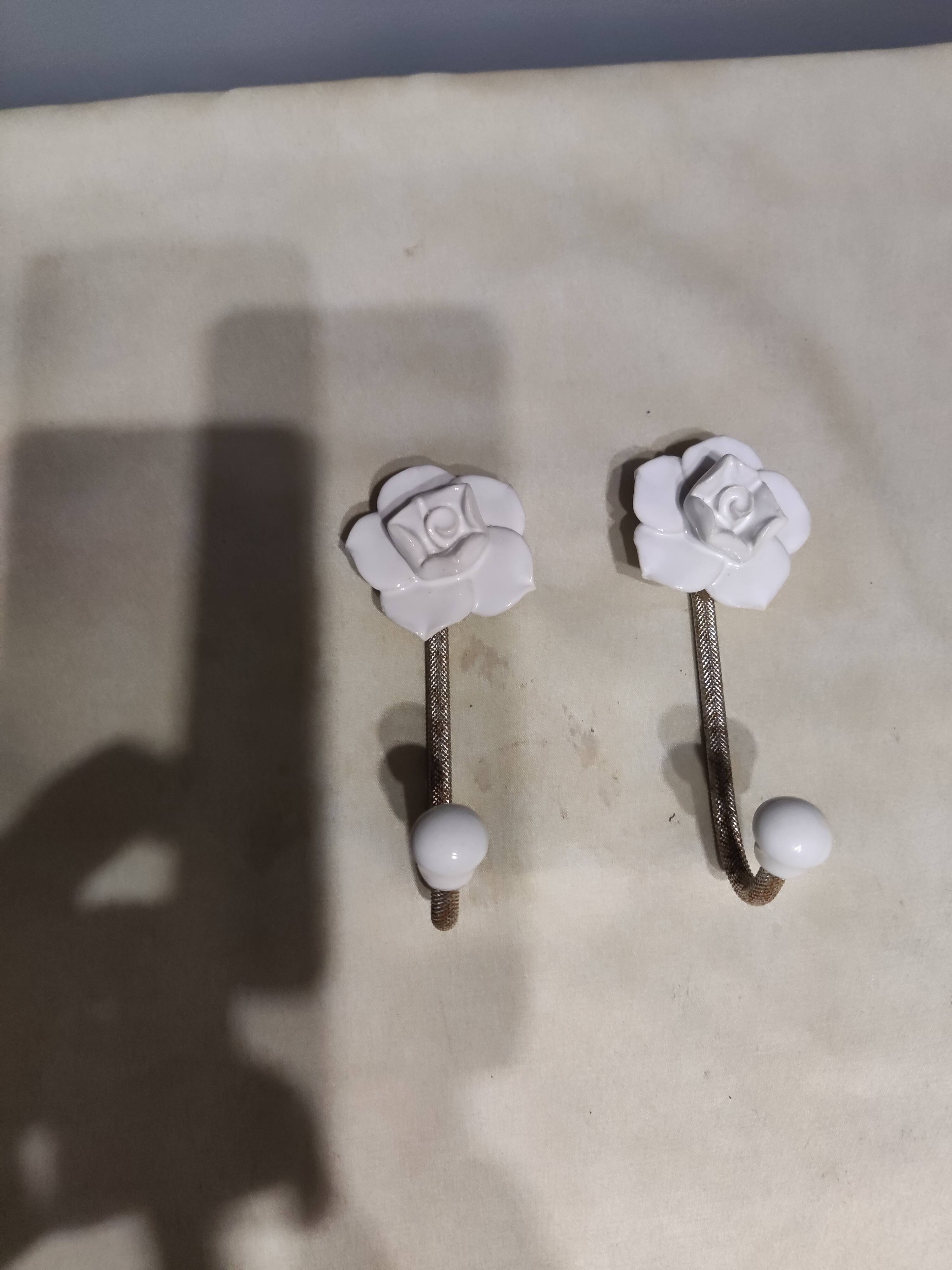 Pair of porcelain hooks