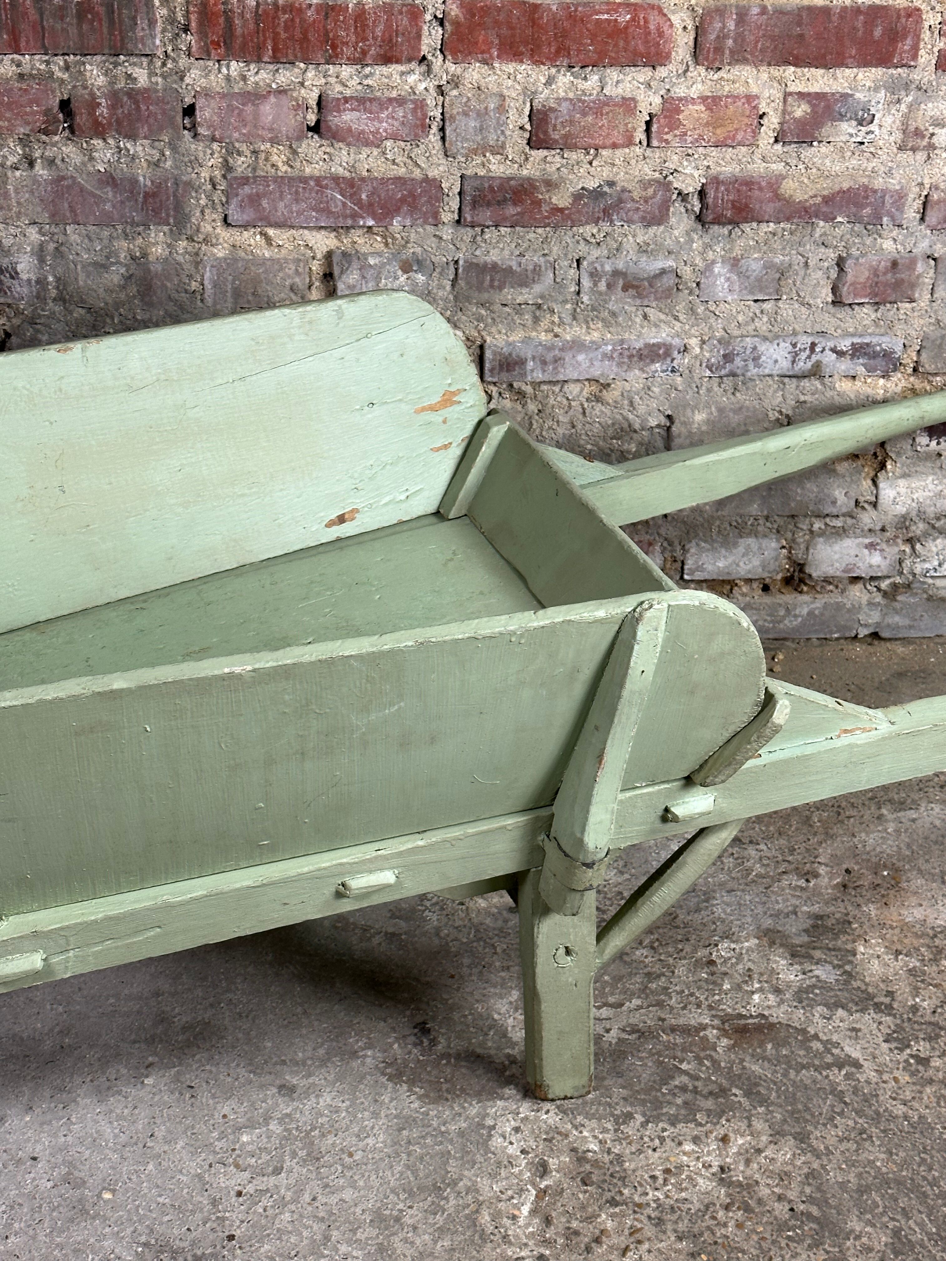 Antique wooden wheelbarrow
