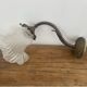Antique bronze wall light in Louis XVI style - tulip-shaped glass paste flower.