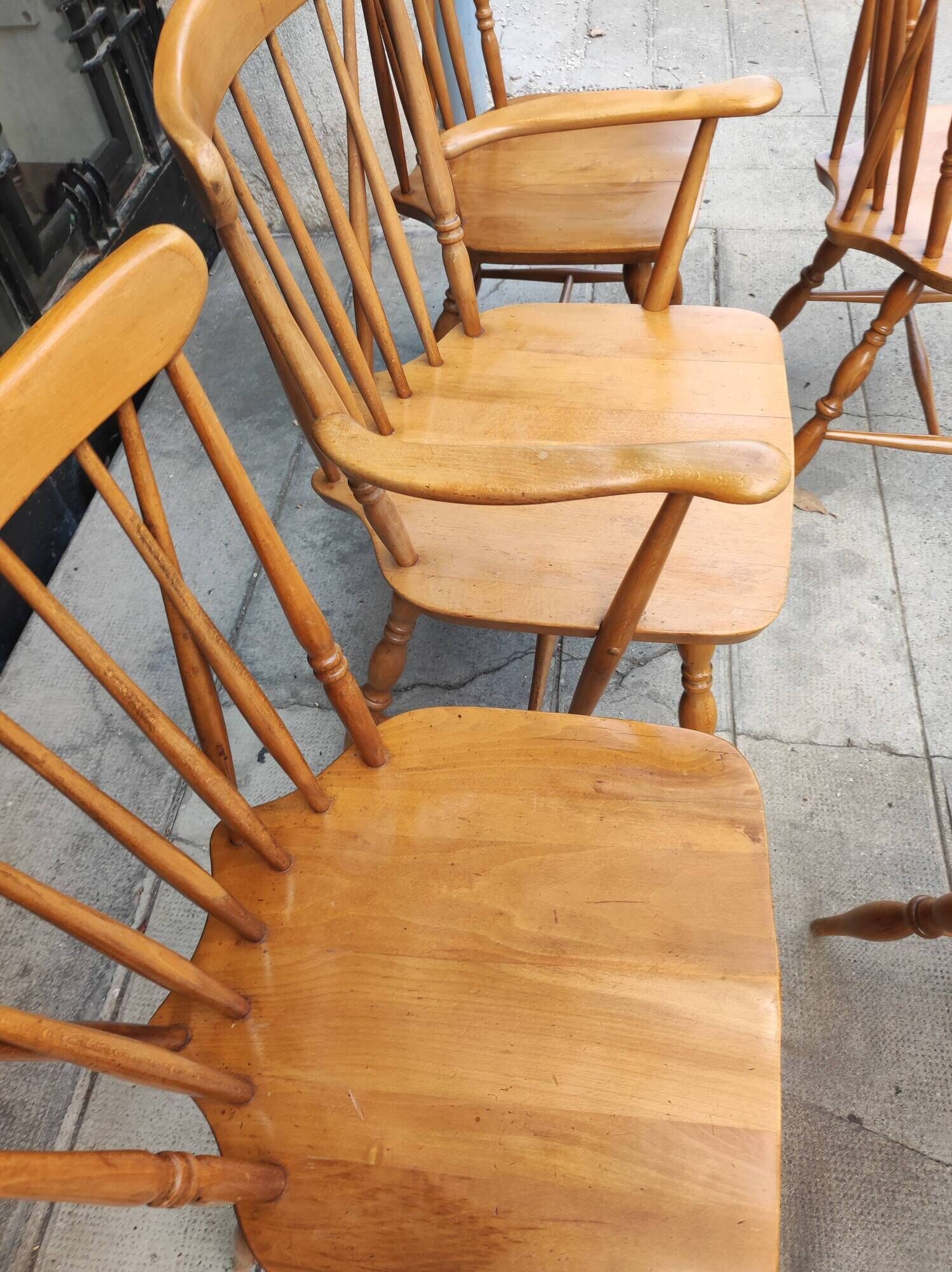 Four chairs and a Heywood Wakefield Windsor armchair. Vintage