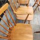 Four chairs and a Heywood Wakefield Windsor armchair. Vintage