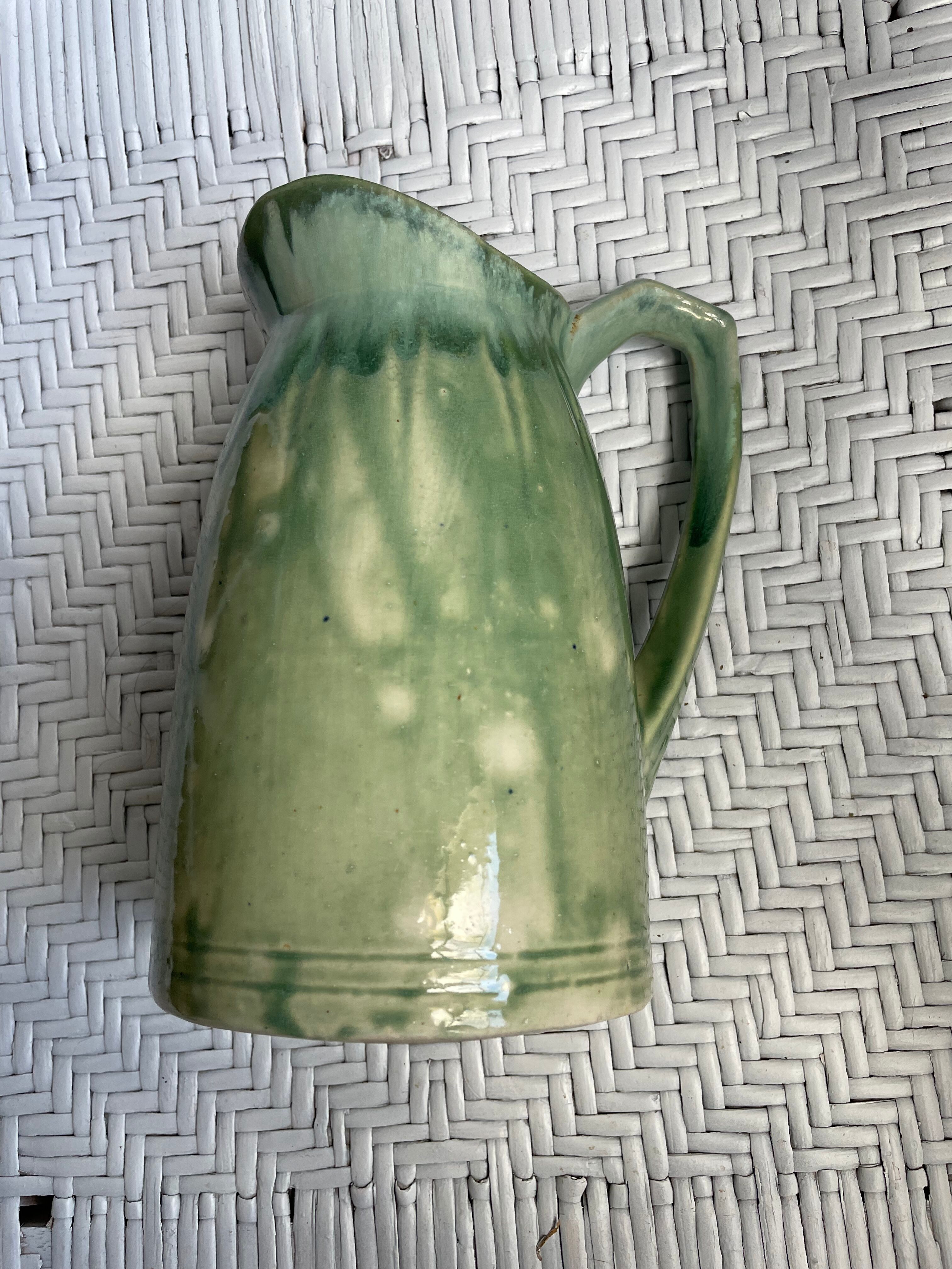 Turquoise green enamelled ceramic pitcher