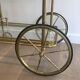 Neoclassical brass rolling table from Maison Baguès