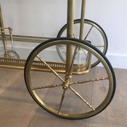 Neoclassical brass rolling table from Maison Baguès