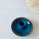 Blue enamelled sandstone candlestick