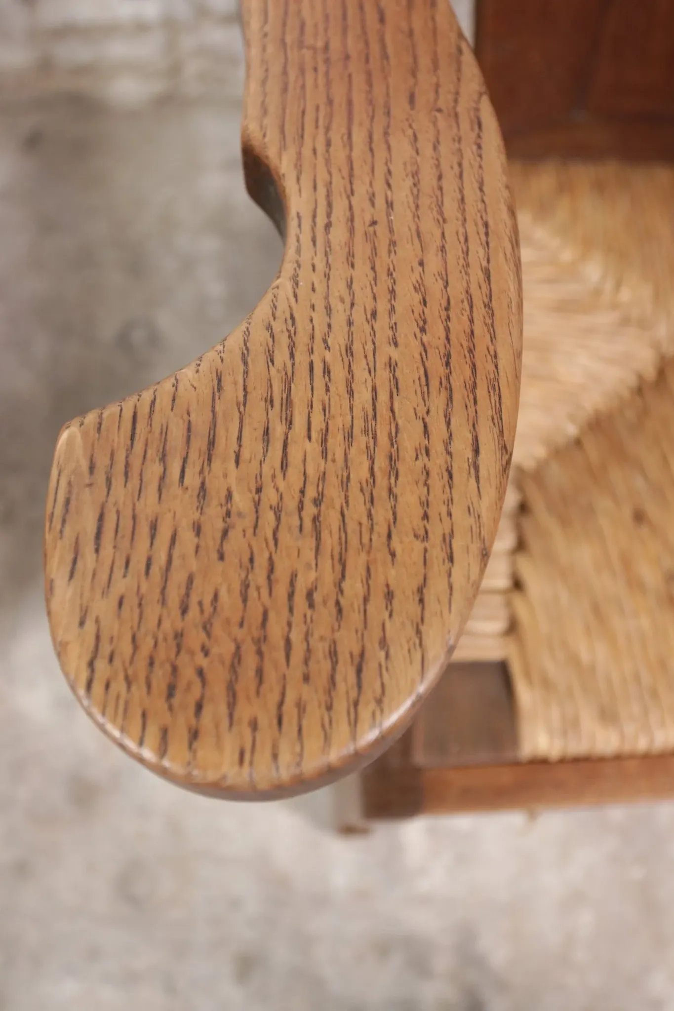 Pair of brutalist oak lounge chairs with rush seats – Netherlands