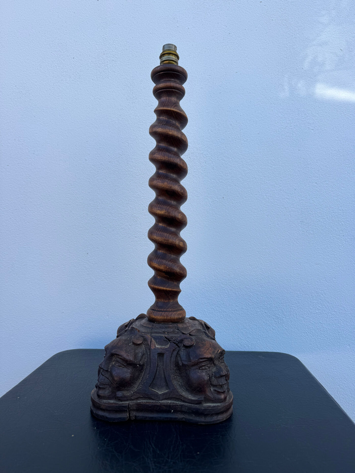 Sculpted wooden lamp with faces, antique.