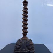Sculpted wooden lamp with faces, antique.
