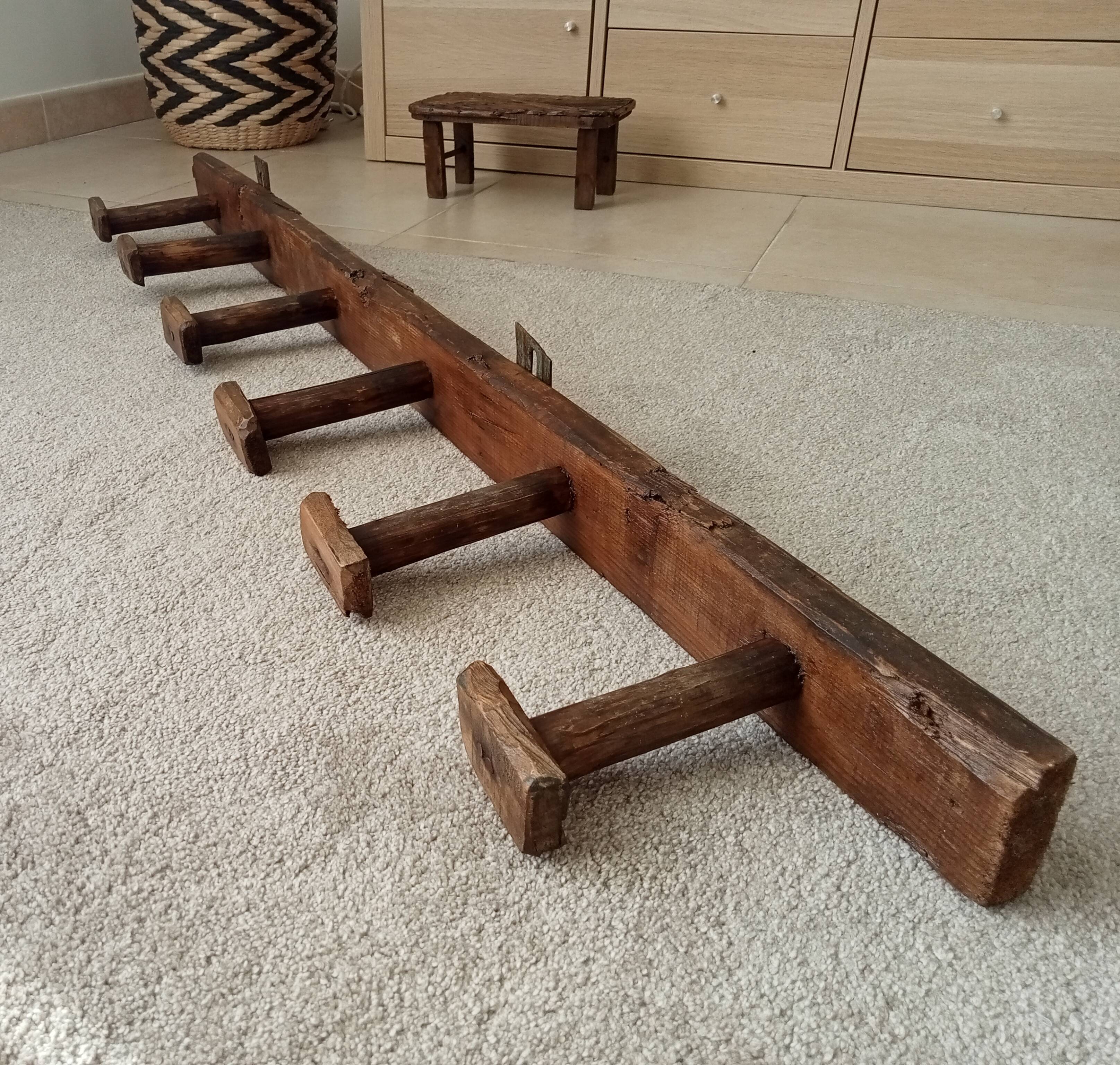 Old wall-mounted coat rack from a stable, folk art.