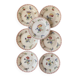 7 hand-painted flowered dinner plates.
