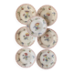7 hand-painted flowered dinner plates.