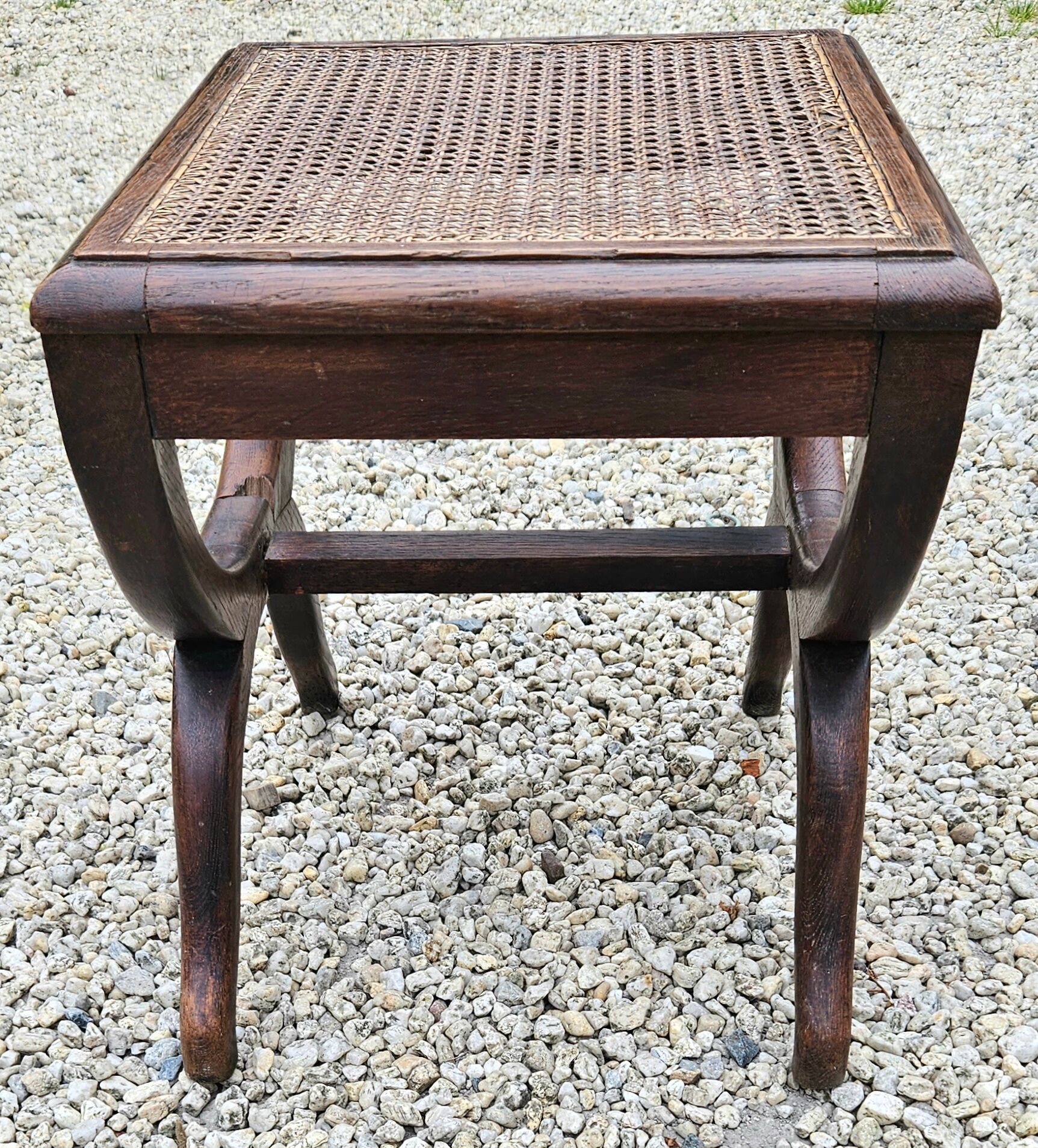 Cross-footed cane stool