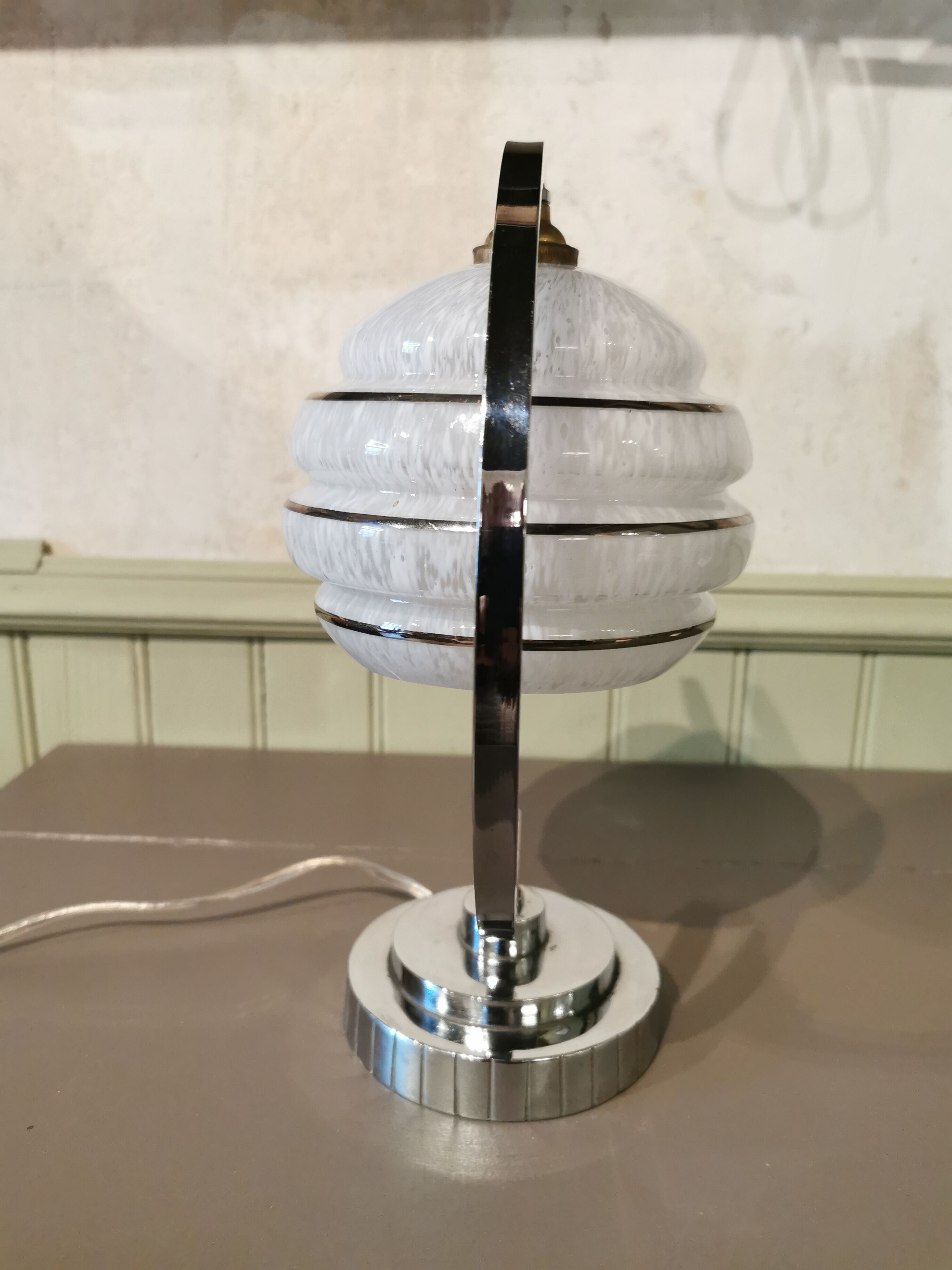 Half-moon chrome art deco lamp