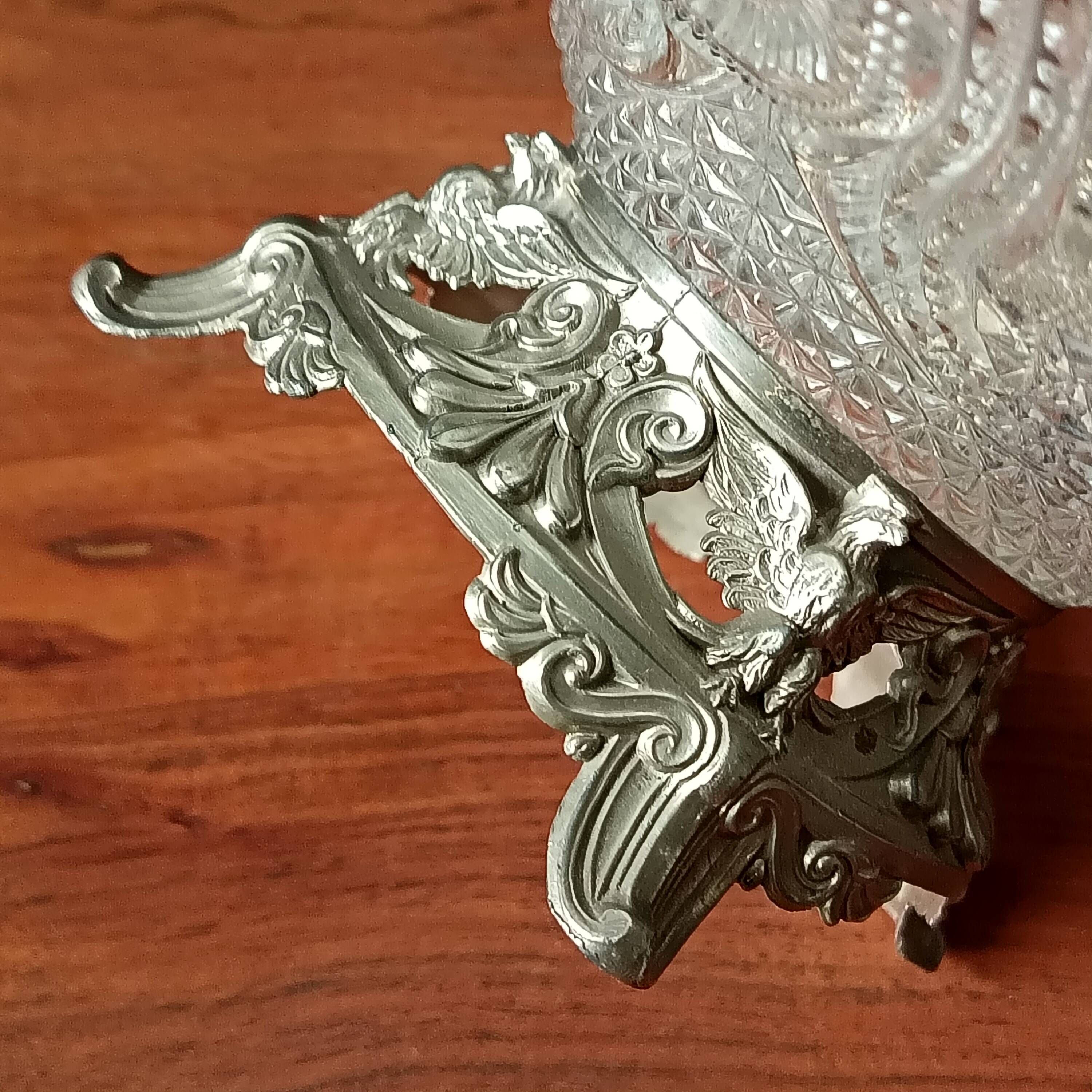Transparent glass dish on vintage metal stand